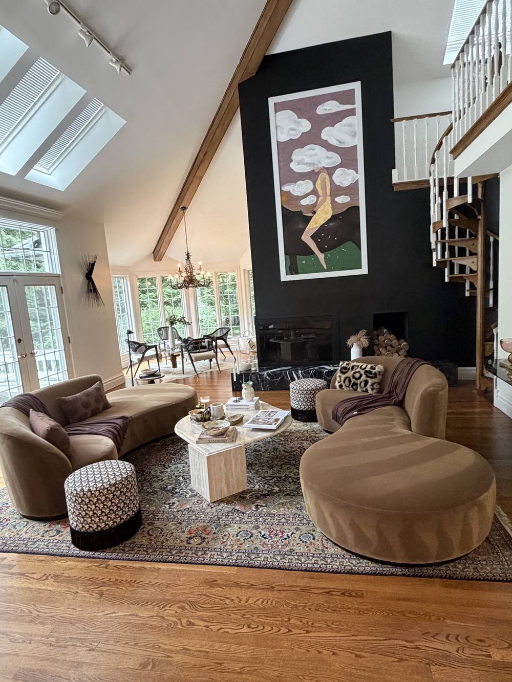 Bright living room with fireplace, velvet sofas and spiral staircase, finished to a Clean and Shiny standard